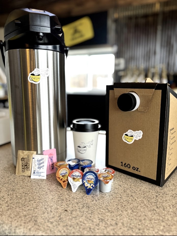 Catering airpot setup with coffee supplies